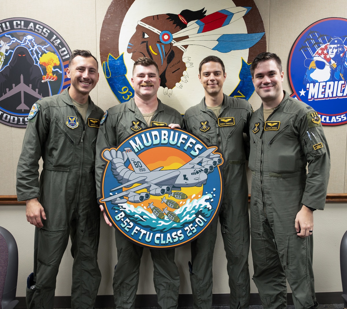 Recent graduates of the B-52 Formal Training Unit pose for photos