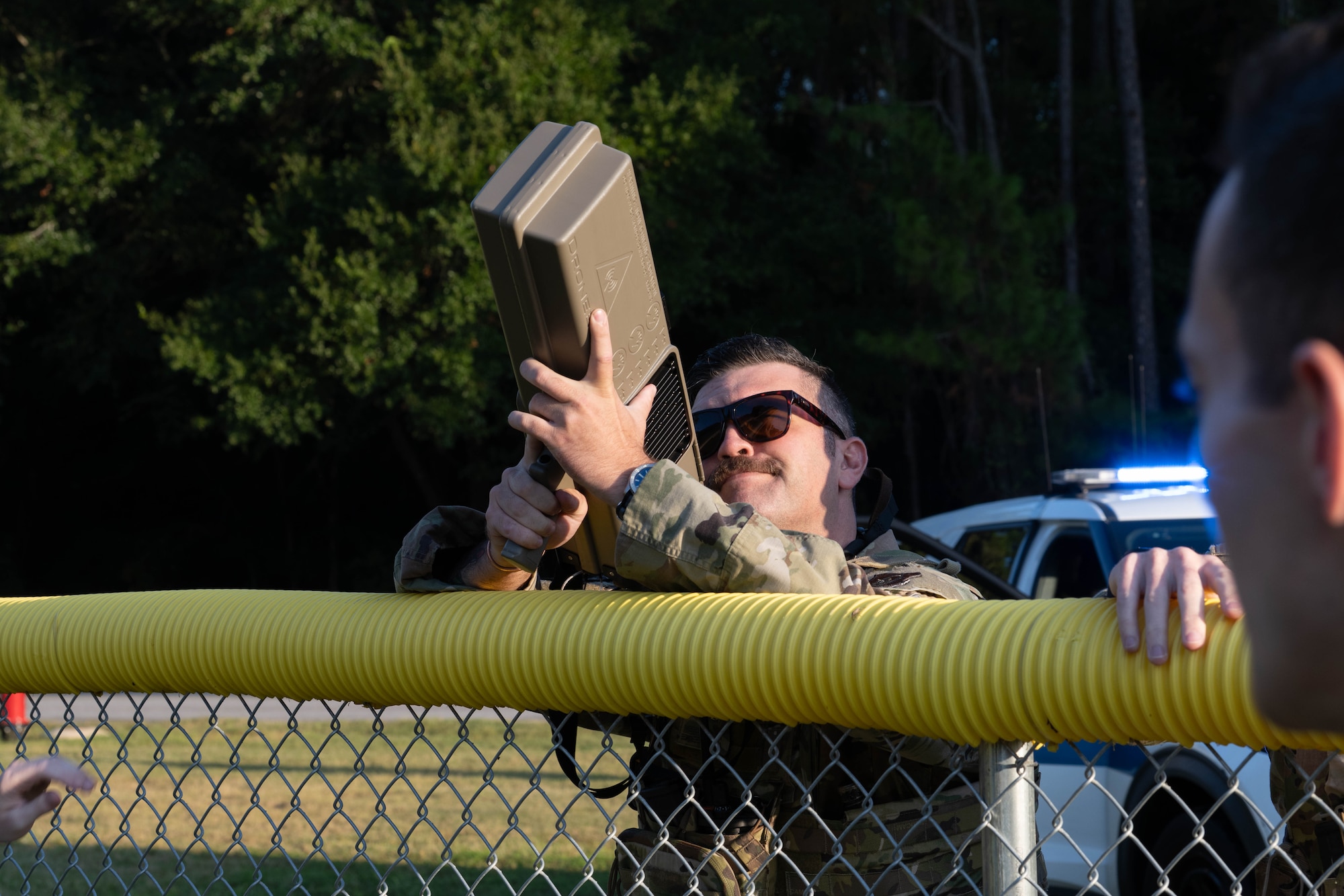 A U.S. Airman assigned to the 1st Special Operations Wing aims a Dronebuster during Exercise Commando Response on Hurlburt Field, Florida, Sept. 8, 2025.