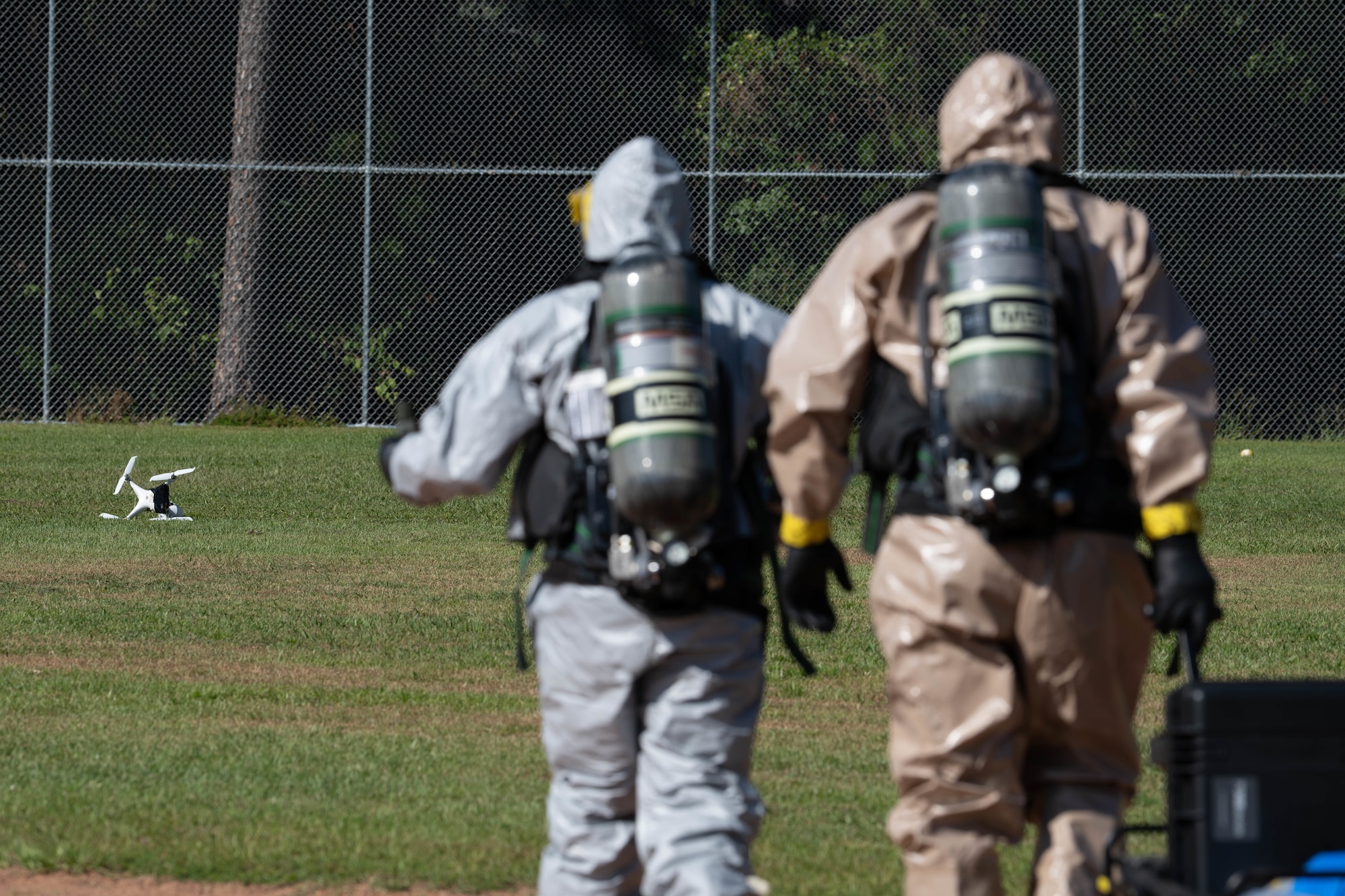 U.S. Airmen, assigned to the 1st Special Operations Wing, walk toward a downed drone during Exercise Commando Response at Hurlburt Field, Florida, Sept. 8, 2025.
