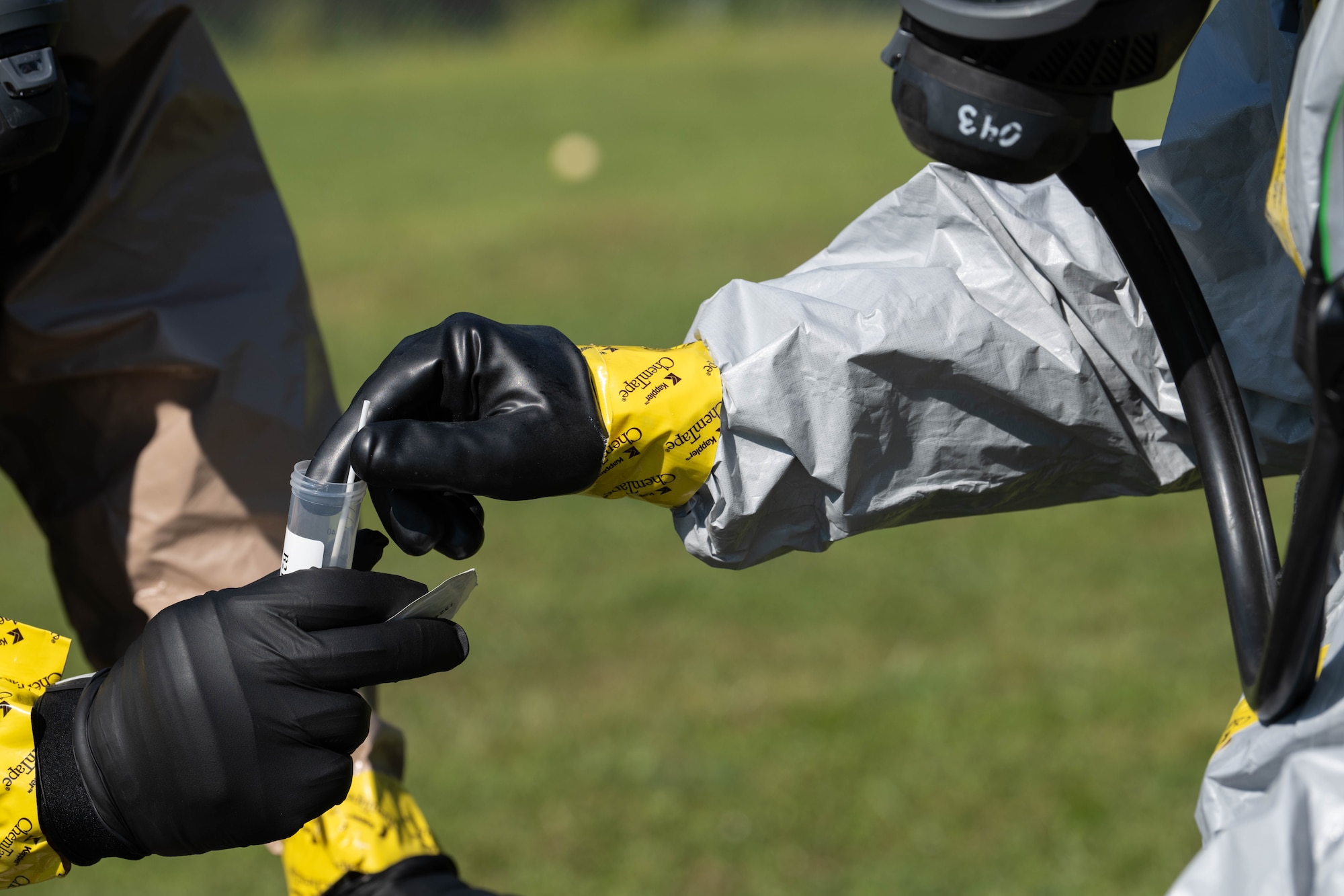 U.S. Airmen assigned to the 1st Special Operations Wing package a simulated chemical sample during Exercise Commando Response at Hurlburt Field, Florida, Sept. 8, 2025.