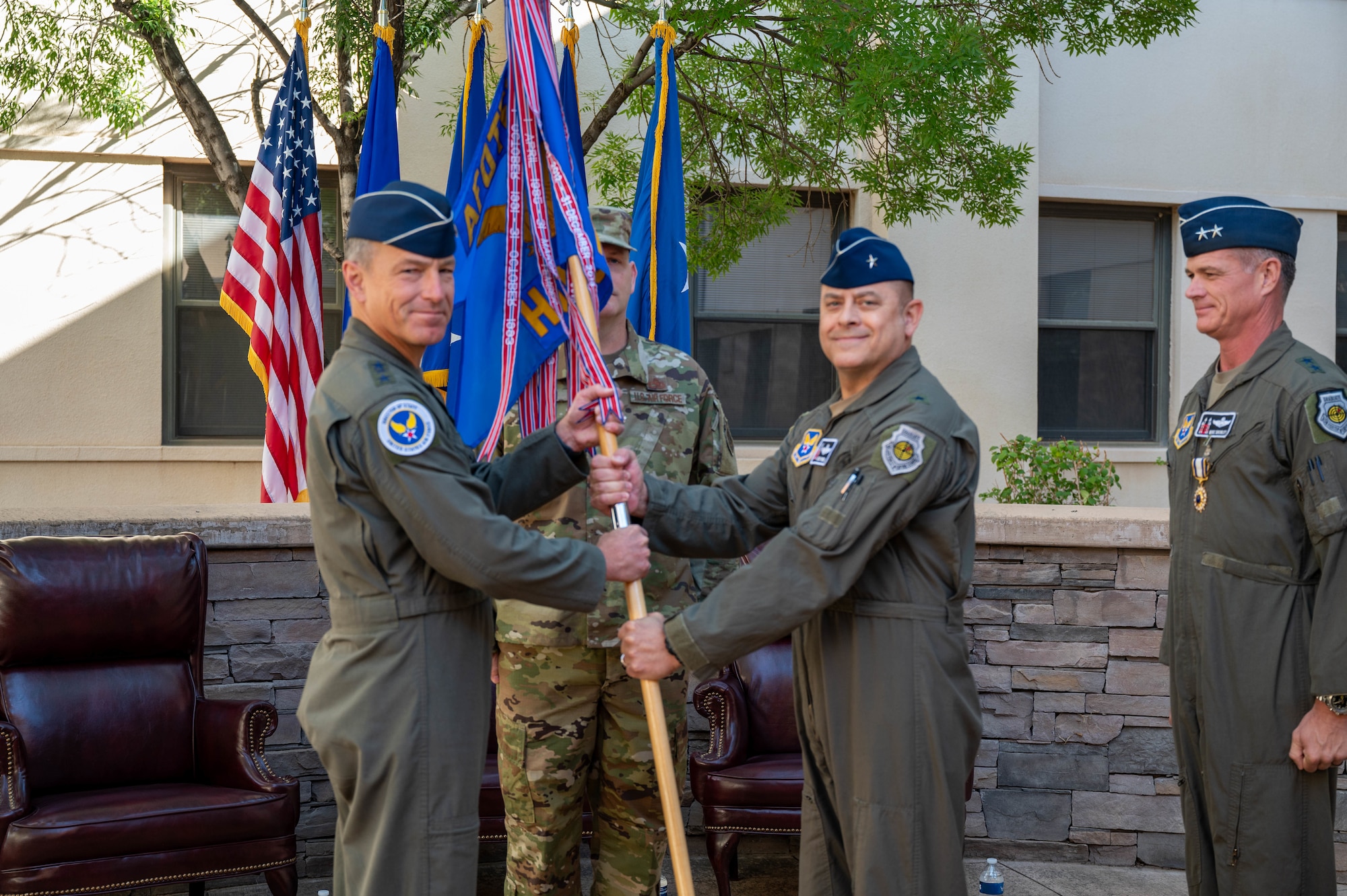 Brig. Gen. Jesse Friedel (middle) accepts command from Lt. Gen. Scott Pleus, Director of Staff, Headquarters Air Force, of the Air Force Operational Test and Evaluation Center. Outgoing AFOTEC Commander Maj. Gen. Michael Drowley (right) will become Special Assistant to the Pacific Air Forces Commander at Joint Base Pearl Harbor-Hickam, Hawaii.