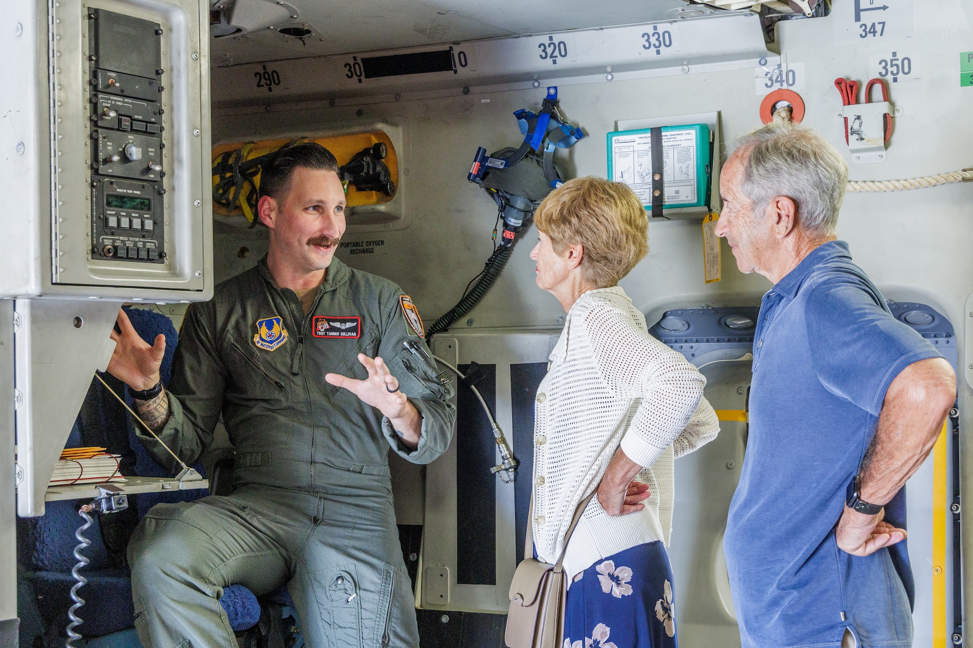 Vietnam War veteran and POW survivor, retired Capt. Paul Granger and his wife Leslie receives a tour of a C-17 from Tech. Sgt. Tanner Sullivan, 418th Flight Test Squadron test loadmaster, on Edwards Air Force Base, California, Sept. 12. During his tour of the aircraft, Granger shared his story of being a B-52 crew member and shot down and taken prisoner during the Vietnam War. (Air Force photo by James West)