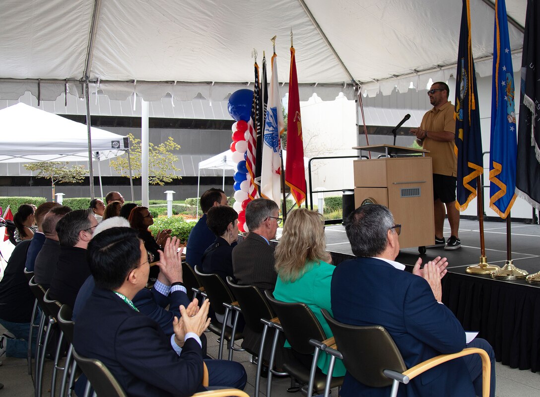 Marine veteran Christopher Scott Louie shares his story while speaking during a ribbon-cutting ceremony for the opening of the VA Long Beach Healthcare System's mental health in-patient and out-patient facilities Aug. 28 in Long Beach, California.