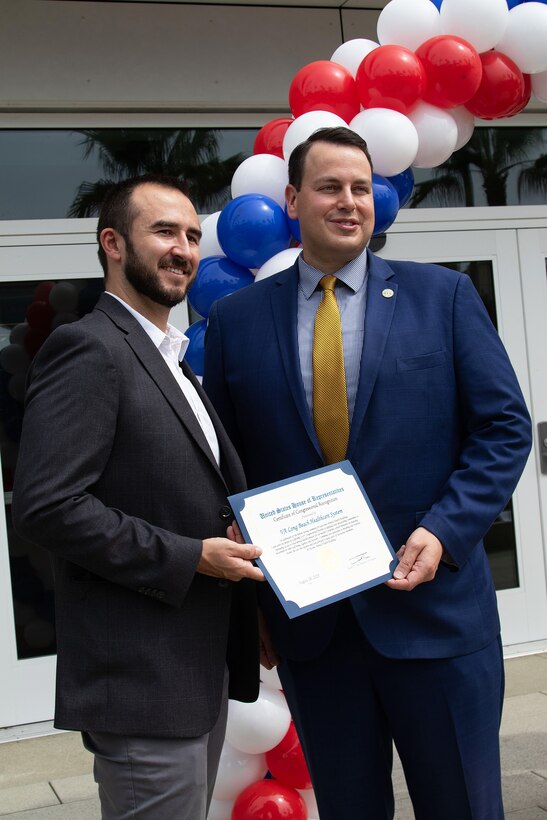 Walt Dannenberg, VA Long Beach Medical Center director, right, accepts a Certificate of Congressional Recognition from Rep. Derek Tran's Office, Congressman with California's 45th District, following a ribbon-cutting ceremony for two mental health facilities Aug. 28 at the Va Long Beach Healthcare System in Long Beach, California.