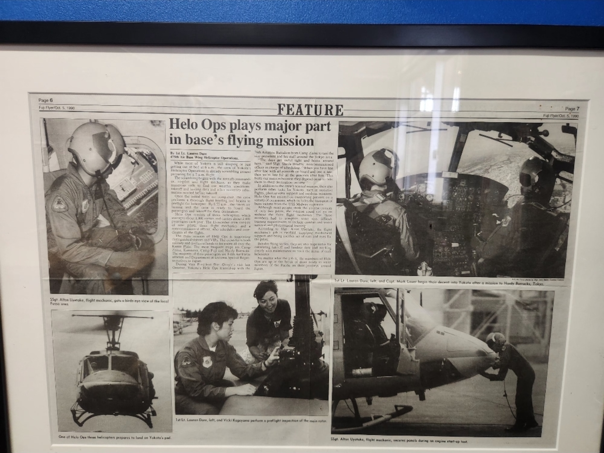 A newspaper clipping highlights the UH-1N Huey