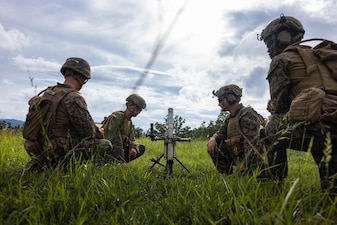 U.S. Marines with 12th Littoral Combat Team, 12th Marine Littoral Regiment, 3rd Marine Division, wait for a fire mission during Resolute Dragon 25 at Hijudai Maneuver Area, Oita Prefecture, Japan, Sept. 13, 2025.