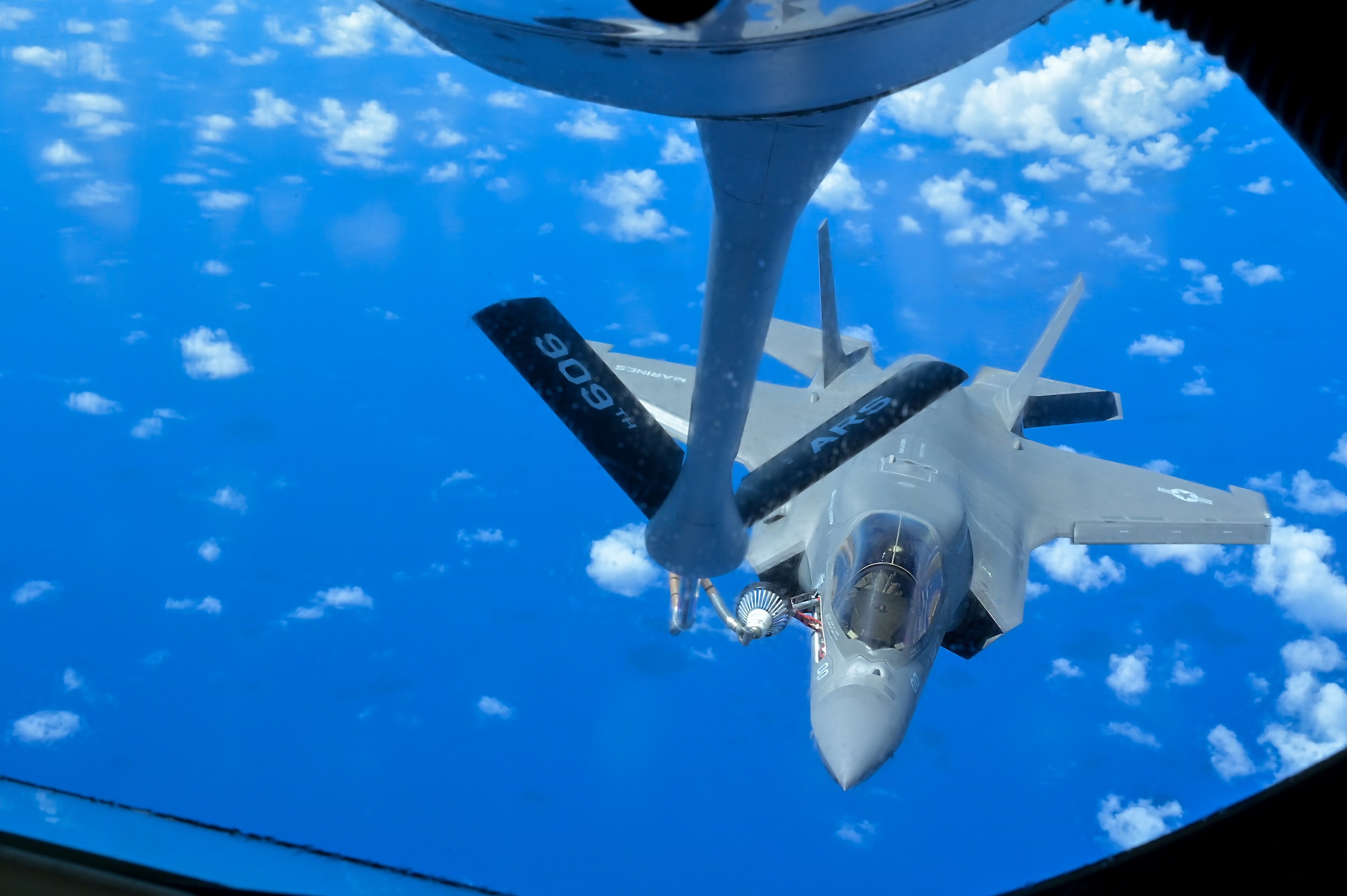 A KC-135 Stratotanker refuels a U.S. Marine Corps aircraft.