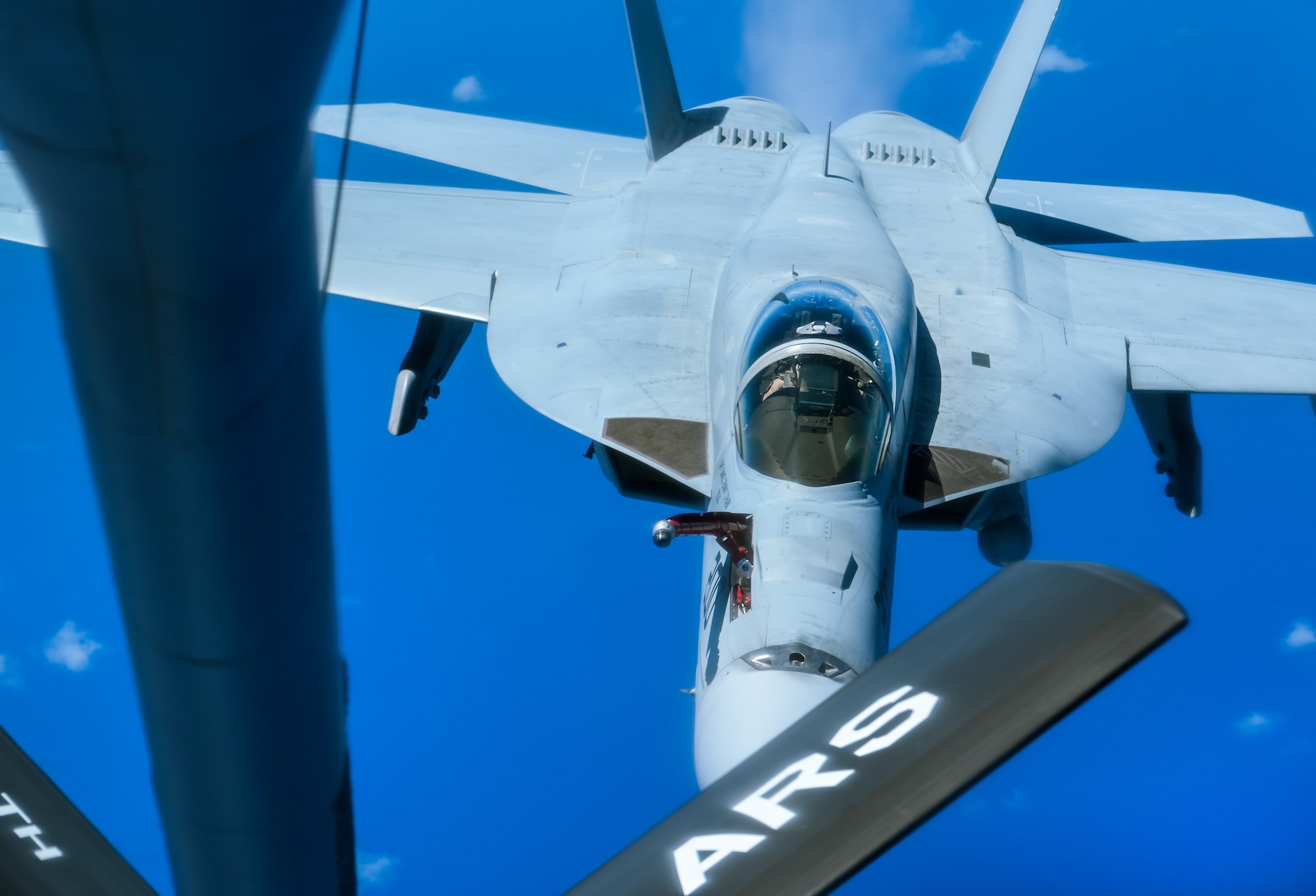 A U.S. Navy aircraft approaches a KC-135 Stratotanker.
