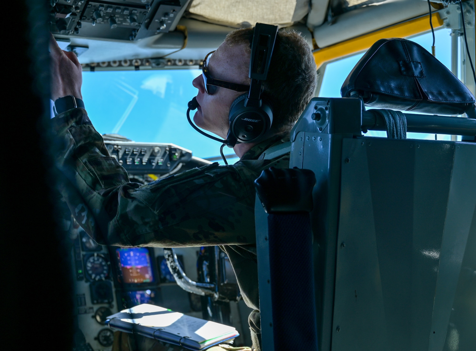 A U.S. service member pilots an aircraft.