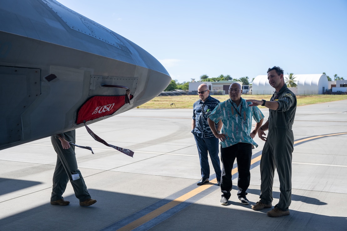 A U.S. Air Force pilot shows civilians an F-22 Raptor up close on Joint Base Pearl Harbor-Hickam, Hawaii.
