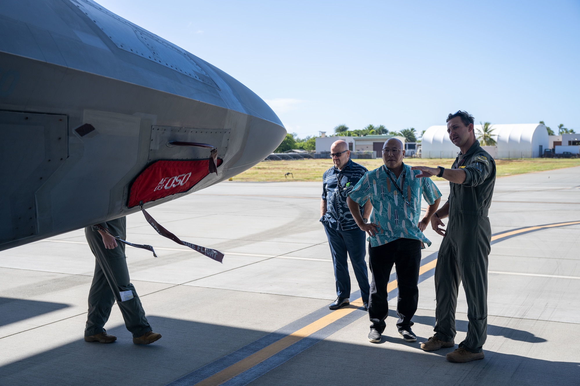 A U.S. Air Force pilot shows civilians an F-22 Raptor up close on Joint Base Pearl Harbor-Hickam, Hawaii.