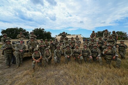 433rd Contingency Response Squadron members posed for a group photo after they trained on airfield setup, security force integration, and equipment deployment at the 433rd Airlift Wing flightline here August 4, 2025.