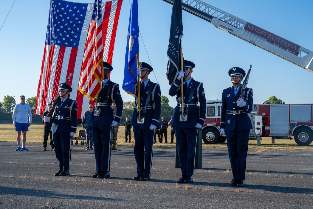 Wright-Patterson Honor Guard present the colors before the Run for the Fall at Wright-Patterson Air Force Base, Sept. 11, 2025. Several hundred members of the Wright-Patt community participated in the annual Run for the Fallen to honor those killed in the Sept. 11 terrorist attacks. (U.S. Air Force photo by Jack Gardner)