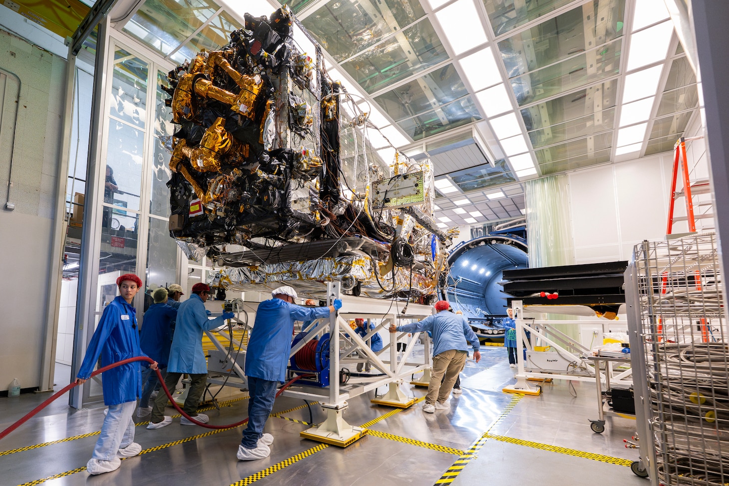 The Robotic Servicing of Geosynchronous Satellites (RSGS) payload integrated with the Northrop Grumman Mission Robotics Vehicle (MRV) spacecraft bus moves into the cryogenic thermal vacuum chamber for testing at the U.S. Naval Research Laboratory’s (NRL) Naval Center for Space Technology (NCST) in Washington, D.C., July 24, 2025. NRL NCST, with funding support from the Defense Advanced Research Projects Agency (DARPA), is conducting final space-readiness testing on RSGS, a robotic payload designed to extend and upgrade satellites already in orbit.