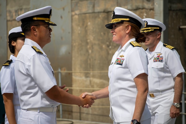 U.S. 7th Fleet Vice Commander Rear Adm. Katie Sheldon, right, greets Republic of Korea Navy 2nd Fleet Deputy Commander Rear Adm. Lee Jae-seop during a welcoming ceremony for U.S. 7th Fleet flagship USS Blue Ridge (LCC 19) in Pyeongtaek, South Korea, Sept. 18, 2025.