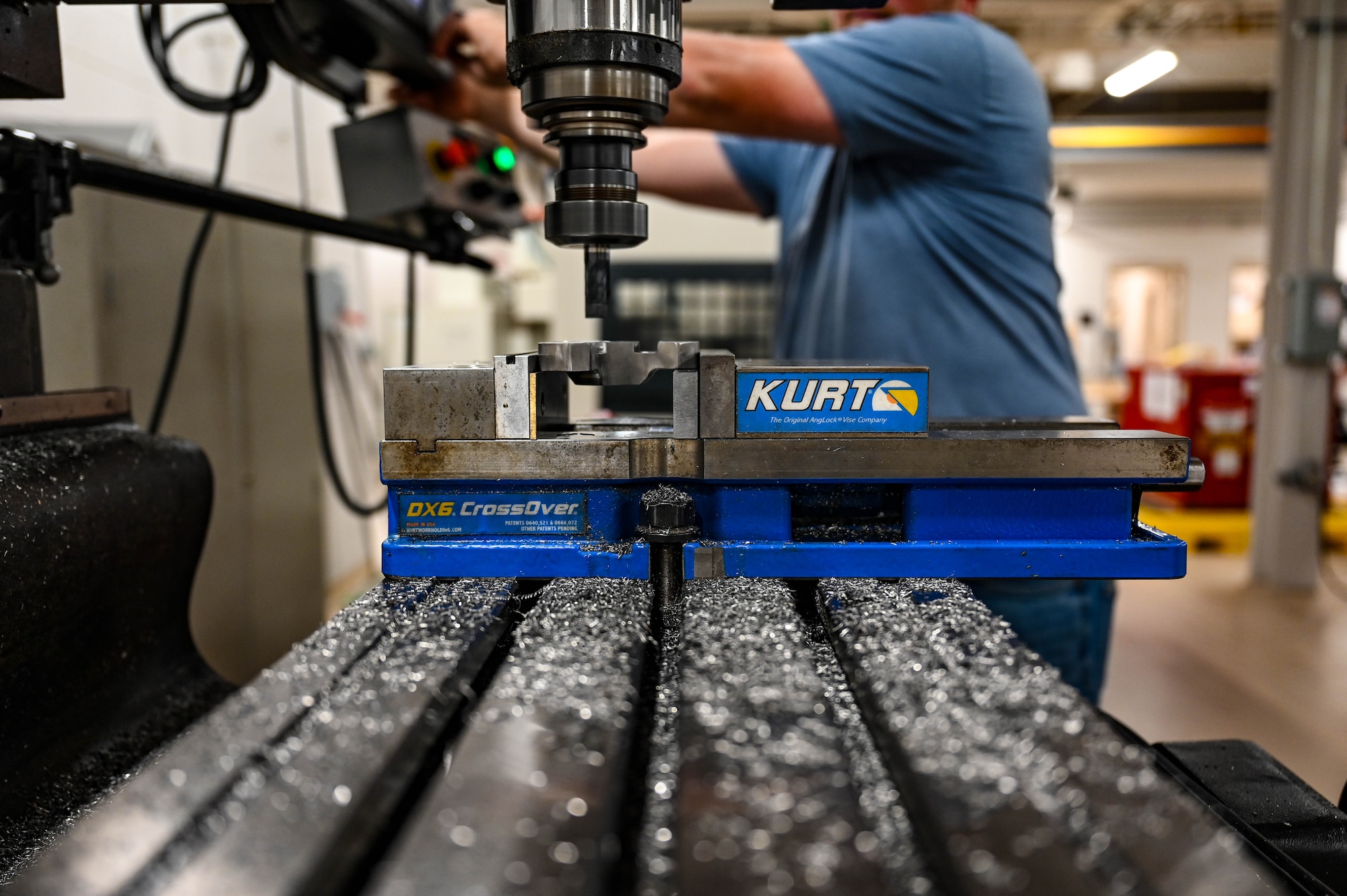 Metal shavings rest on a machine as a engine drive motor adapter is made.