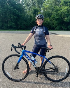 U.S. Air Force Staff Sgt. Faith Xiongblaxang rides along the Gateway Trail en route to Stillwater, Minn, as part of the Air Force Cycling Team in July 2023.