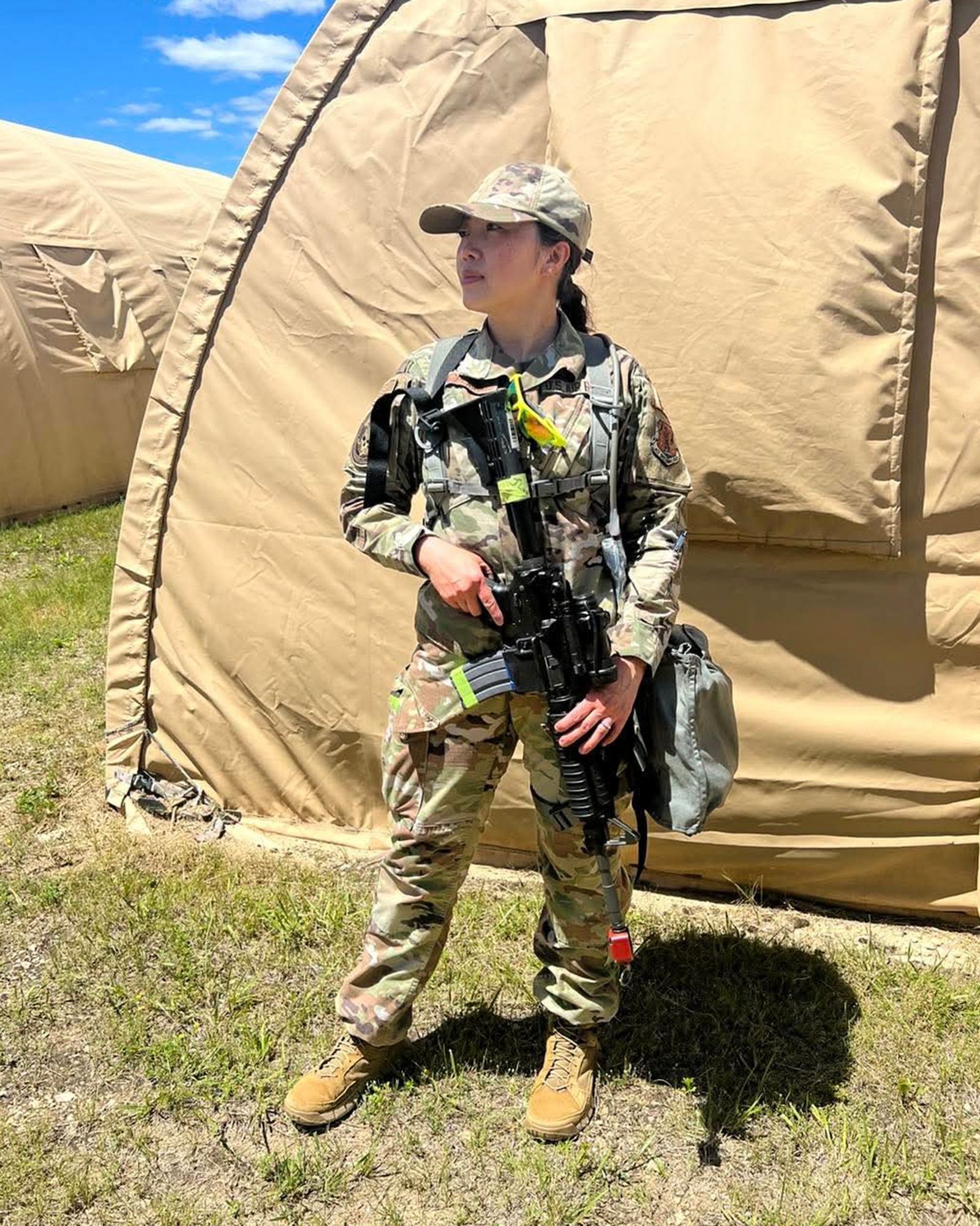 U.S. Air Force Staff Sgt. Faith Xiongblaxang scans the perimeter at Volk Field Air National Guard Base, Wis., in June 2024.