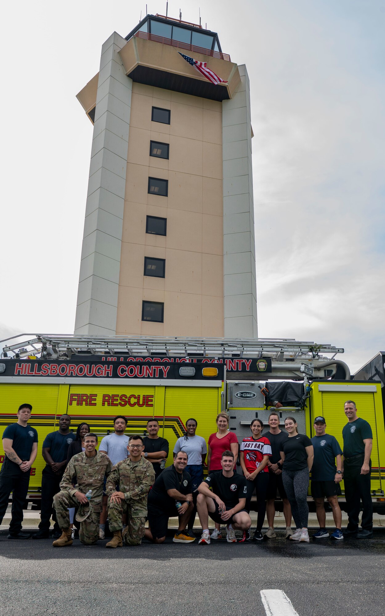 Airmen assigned to the 6th Air Refueling Wing pose for a group photo with Hillsborough County Firefighters after completing a 9/11 Memorial Climb at MacDill Air Force Base, Florida, Sep. 11, 2025. Participants climbed nine flights of stairs 411 times to honor the 411 first responders who lost their lives during the Sept. 11, 2001, terrorist attacks on the World Trade Center. (U.S. Air Force photo by Airman 1st Class Monique Stober)