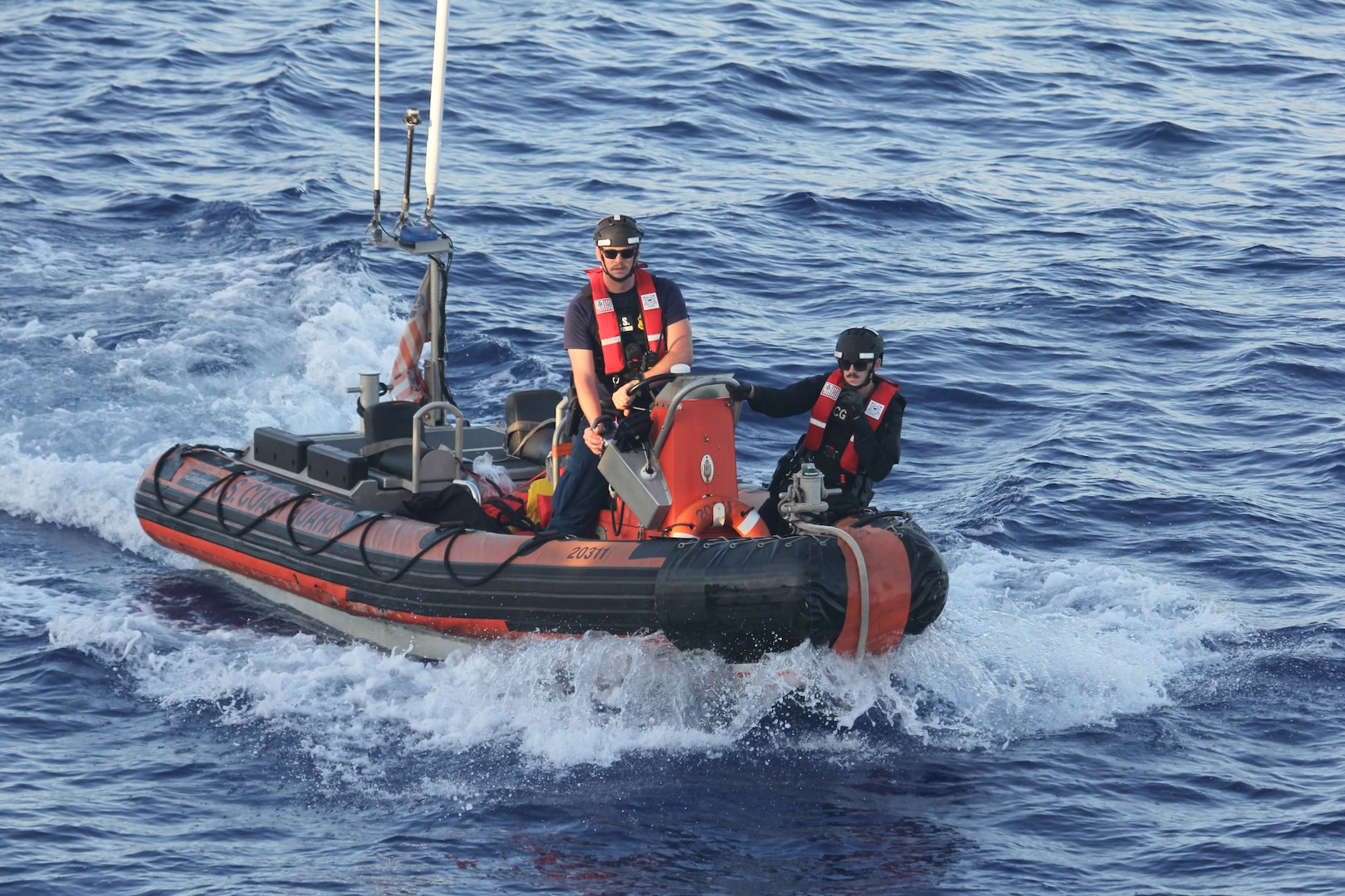 A Coast Guard Cutter Spencer (WMEC 905) small boatcrew facilitates the transfer of aliens and supplies during early morning operations in the Windward Passage, Aug. 29, 2025. Spencer’s crew conducted an 83-day patrol in the Windward Passage and Caribbean Sea to deter illegal migration in the region and protect America’s maritime borders. (U.S. Coast Guard photo by Petty Officer 3rd Class Norwood Richardson)