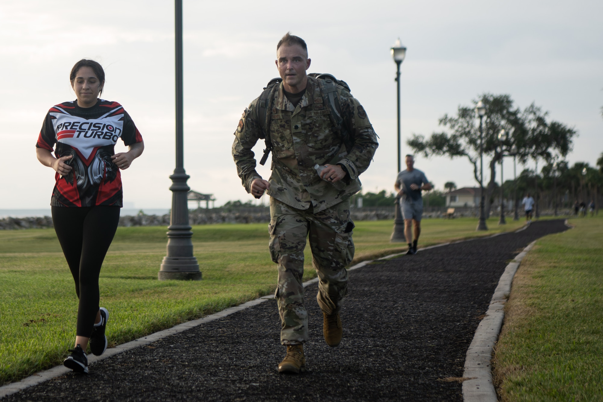 U.S. Air Force Lt. Col. John Clements III, 6th Security Forces Squadron commander, rucks during the 16th annual Helton Hall 5K at MacDill Air Force Base, Florida, Sept. 8, 2025. The 5K was held in memory of 1st Lt. Joseph D. Helton Jr., the first security forces officer killed in military operations since the Vietnam War. (U.S. Air Force photo by Airman 1st Class Helen Ly)
