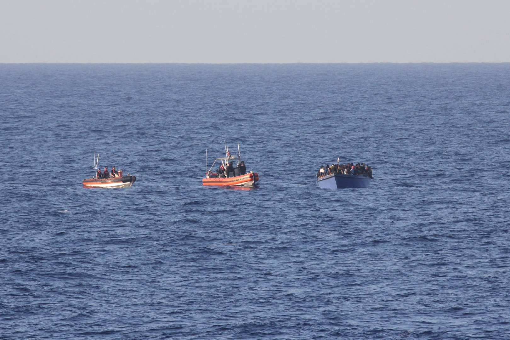 Coast Guard Cutter Spencer (WMEC 905) small boatcrews intercept an overloaded vessel with 191 Haitian aliens approximately 40 miles north of Cap Haitian, Haiti, Aug 29, 2025. All aliens aboard the vessel were repatriated back to Haiti, Sept. 2, following the interdiction. (U.S. Coast Guard photo)