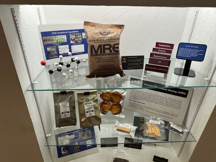A display shelf includes packaged meals and ration bars.