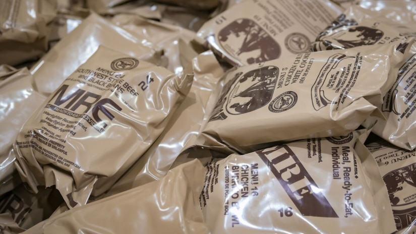 Several packaged items are piled on top of each other.
