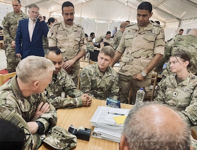 Lt. Gen. Patrick D. Frank, the Commander of U.S. Army Central and Third Army, talks with Illinois Army National Guard Soldiers Sgt. Gavin Hunt of Peoria, Ill., and Spc. Jane Huguelet of Tinley Park, Ill. on Sept. 8.
