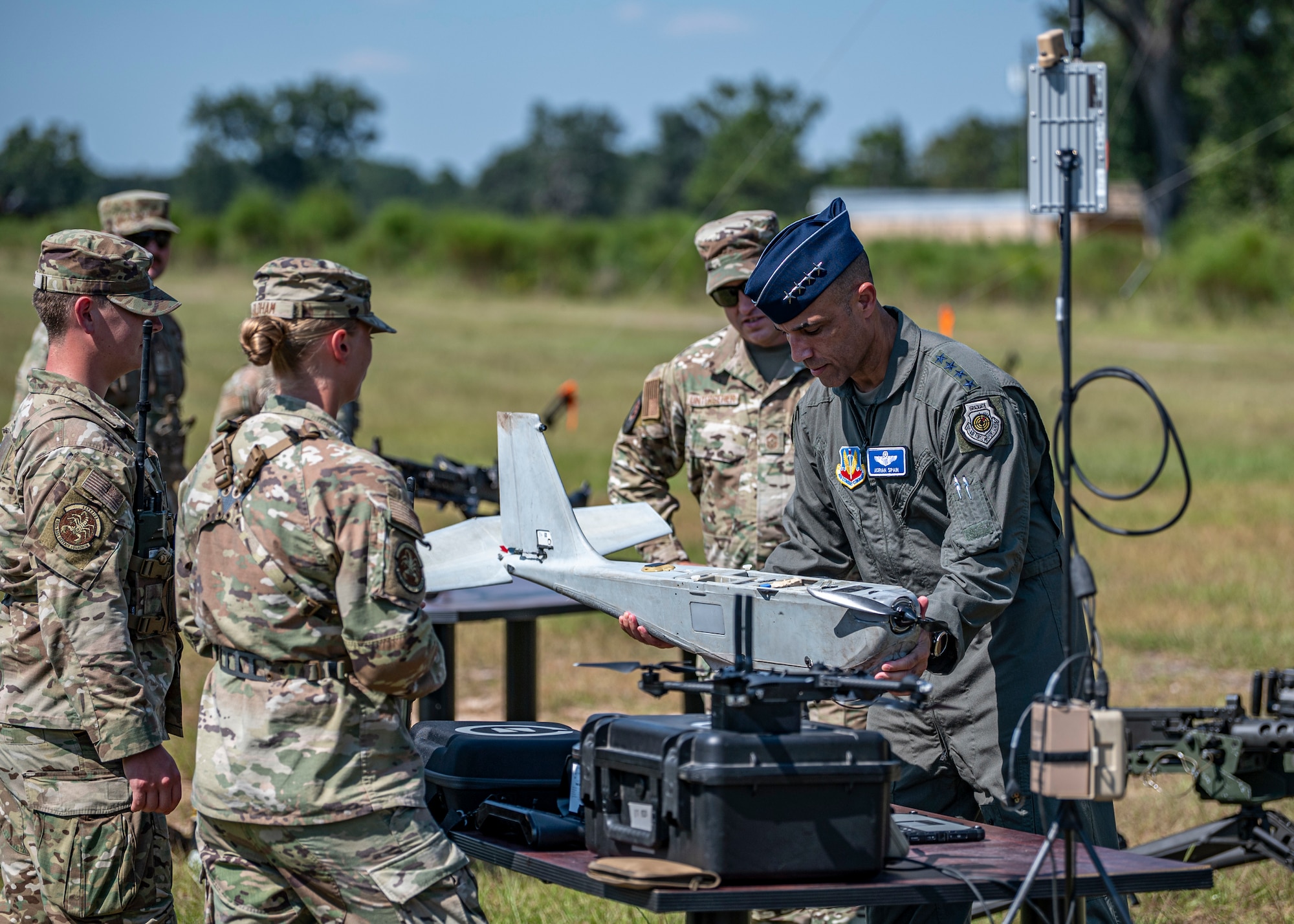 U.S. Air Force Gen. Adrian Spain, commander of Air Combat Command, handles a drone during a demonstration at Moody Air Force Base, Georgia, Sept. 16, 2025. Airmen from the 820th Base Defense Group leverage advanced tools to enhance situational awareness and strengthen defensive operations. (U.S. Air Force photo by Senior Airman Leonid Soubbotine)