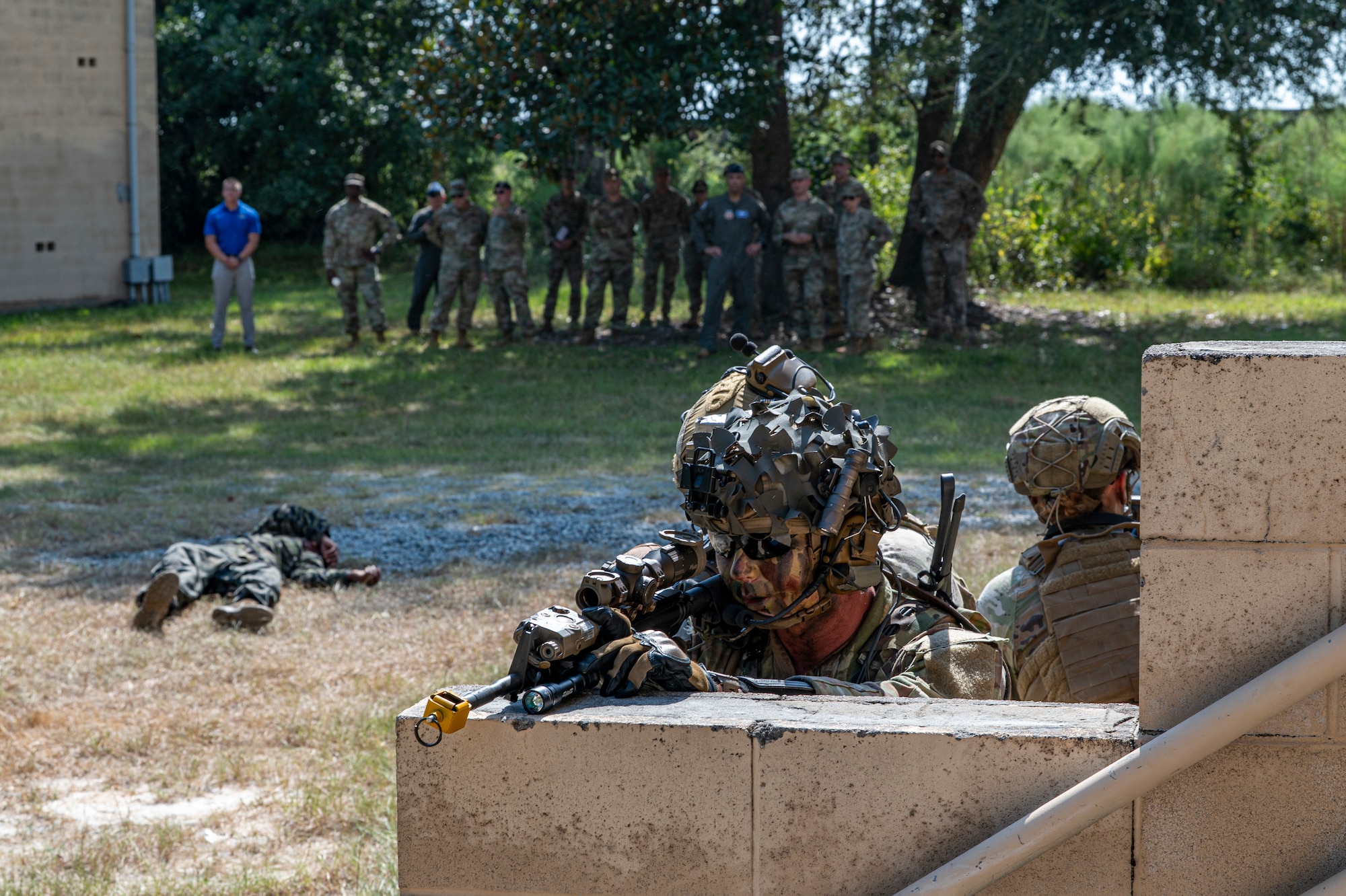 Airmen from the 820th Base Defense Group perform an opposing force tactical drill during a demonstration for Gen. Adrian Spain, commander of Air Combat Command, and Chief Master Sgt. Jeremy Unterseher, ACC command chief, at Moody Air Force Base, Georgia, Sept. 16, 2025. The drill highlighted how the 820th BDG trains to secure air bases and sustain operations in contested environments. (U.S. Air Force photo by Senior Airman Leonid Soubbotine).