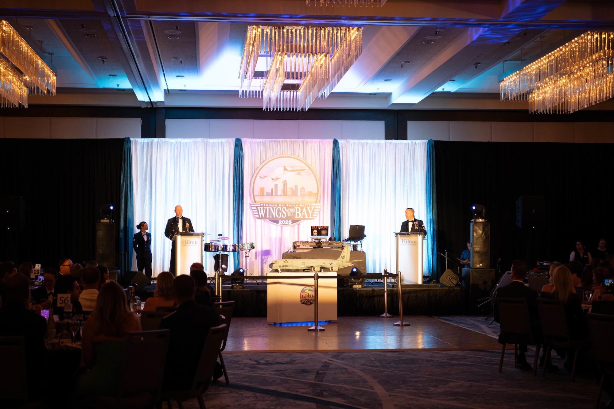 U.S. Air Force Col. Edward Szczepanik, 6th Air Refueling Wing commander, and Chief Master Sgt. Christopher Ottenwess, 6th ARW command chief, provide opening remarks during the Air Force Ball in Tampa, Florida, Sept. 13, 2025. The Air Force Ball is an annual tradition held to celebrate the legacy of the Air Force and the accomplishments of the hosting unit over the past year. (U.S. Air Force photo by Staff Sgt. Christopher Tam)