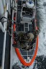 Members of a U.S. East Coast-based Naval Special Warfare Operator (SEAL) team and the U.S. Coast Guard Maritime Security Response Team (MSRT) West conduct a visit, board, search, and seizure (VBSS) training aboard the National Oceanic and Atmospheric Administration Ship (NOAA) Fairweather (S 220)