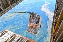 Package drops off the back of an aircraft