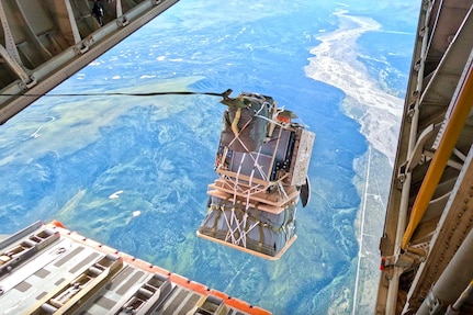 Package drops off the back of an aircraft