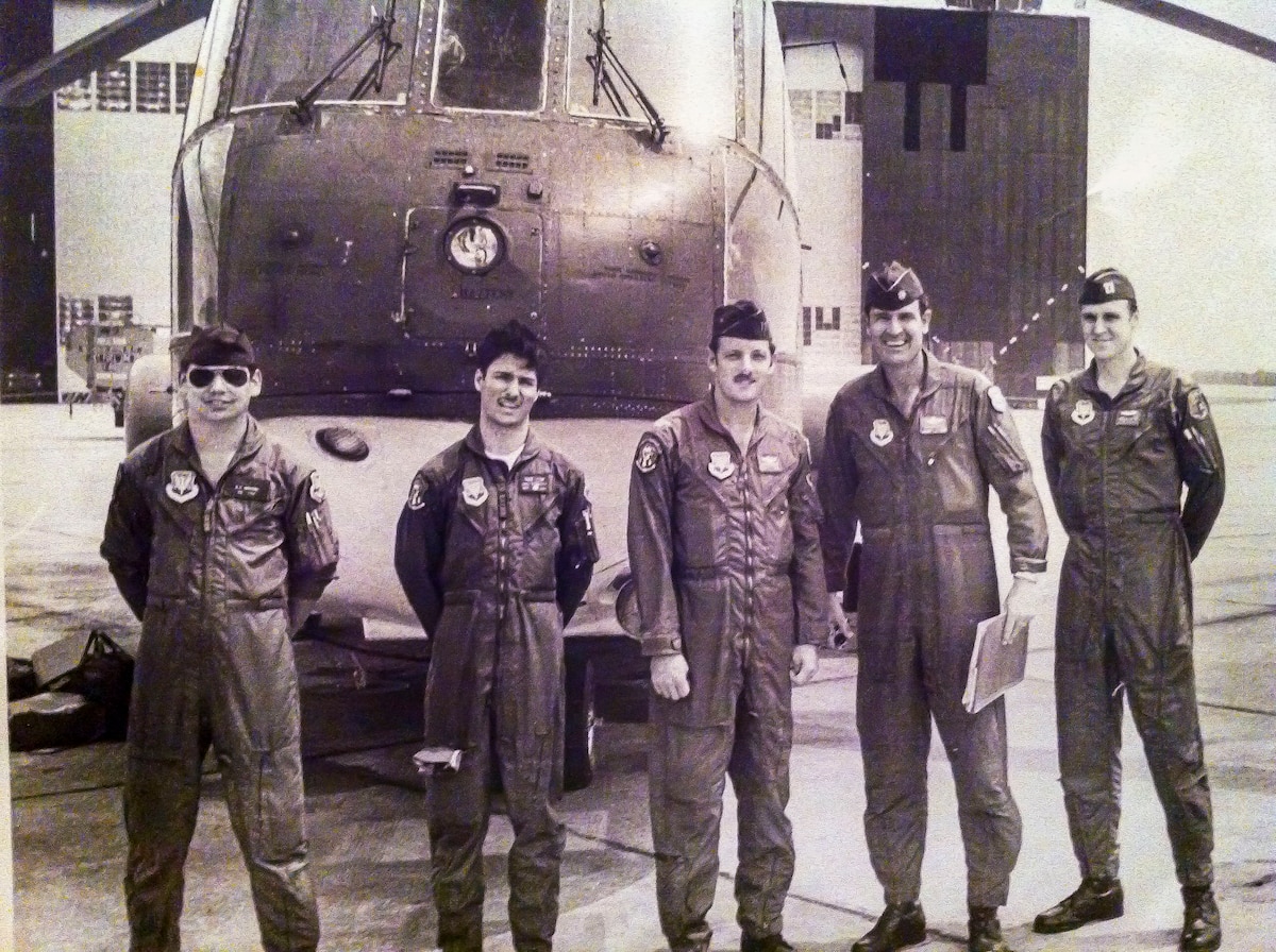 U.S. Air Force Senior Airman Karl McGregor, second from left, poses with his squadron commander, fourth from left, and fellow Airmen at Shaw Air Force Base, S.C., in 1978. McGregor served as a flight engineer aboard the CH-3 Jolly Green Giant helicopter, supporting tactical airlift and rescue missions during his early career. (Courtesy photo from McGregor)