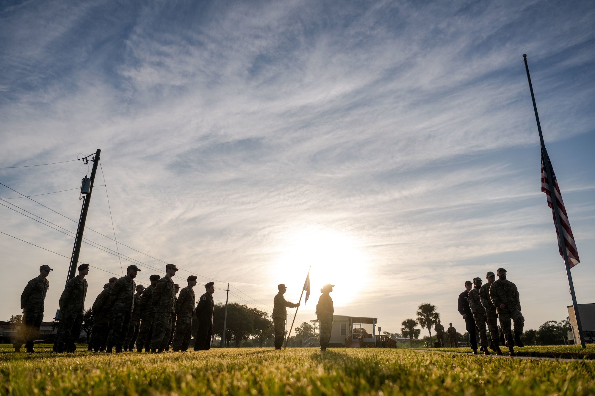 Airman Leadership School Class 25-F students perform reveille at MacDill Air Force Base, Florida, Sept. 2, 2025.  ALS students performed reveille and retreat practices daily. The repetition allowed students to embody the Air Force’s core values while executing a long standing military tradition. (U.S. Air Force photo by Senior Airman Zachary Foster)