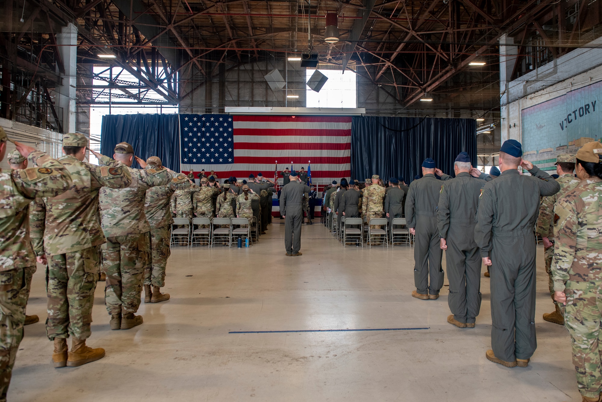 Members assigned to the new 25th Attack Wing render their first salute during a wing redesignation ceremony at Shaw Air Force Base, South Carolina, Sept. 18, 2025.
