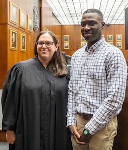 Illinois Army National Guard Spc. Adiodun Lucas with U.S. District Judge Georgia Alexakis during a naturalization ceremony Sept. 15 at the Dirksen U.S. Courthouse in Chicago. Lucas, who immigrated to the United States in 2011, enlisted in the Illinois Army National Guard in 2024, and pursued citizenship through the military expedited naturalization process.