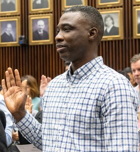 Illinois Army National Guard Spc. Adiodun Lucas recites the oath of citizenship during a naturalization ceremony Sept. 15 at the Dirksen U.S. Courthouse in Chicago. Lucas, who immigrated to the United States in 2011, enlisted in the Illinois Army National Guard in 2024.