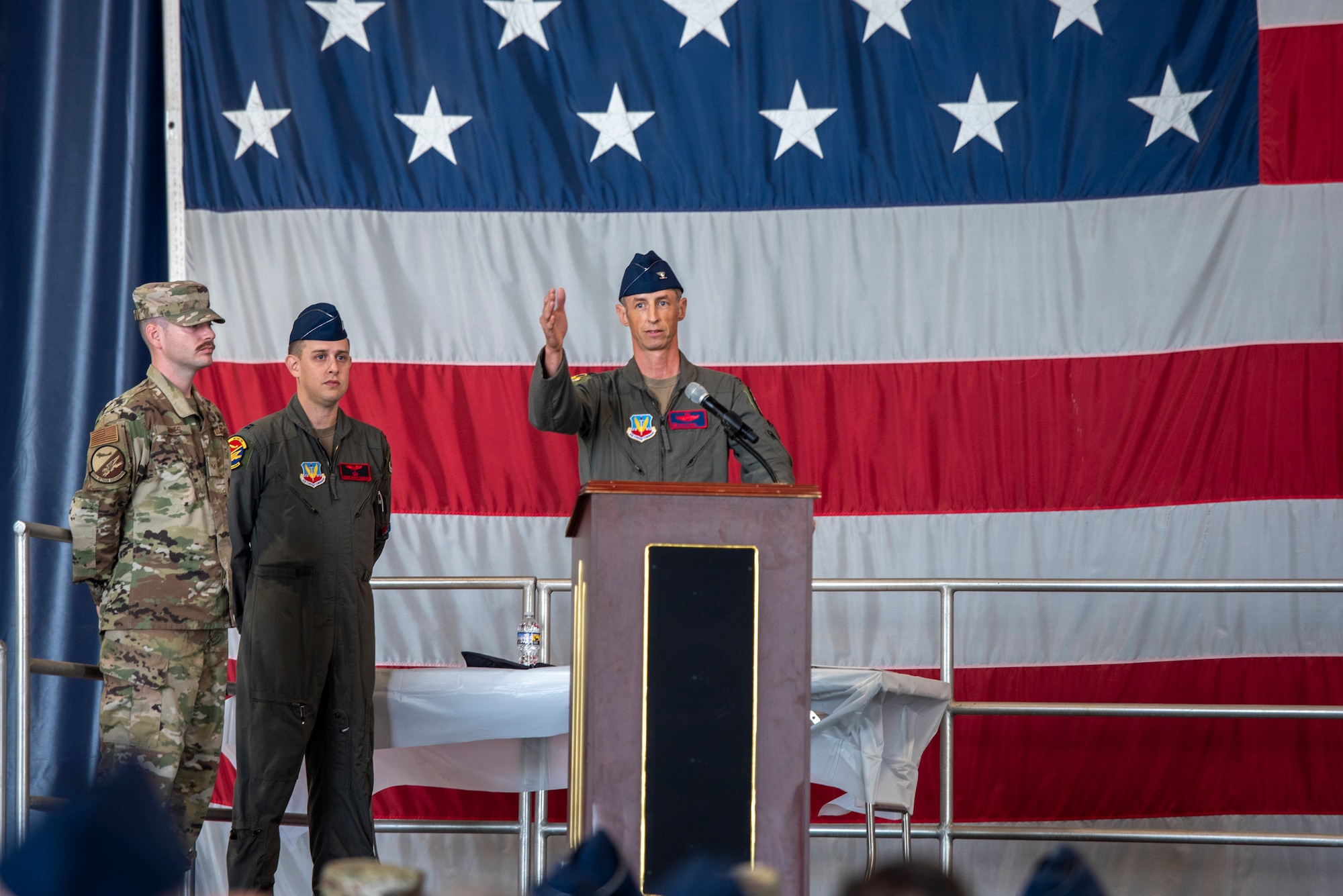 U.S. Air Force Col. Brad Howell, 25th Attack Wing commander, addresses wing personnel for the first time during a wing redesignation ceremony at Shaw Air Force Base, South Carolina, Sept. 18, 2025.