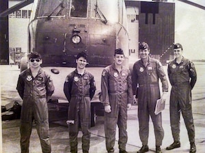 U.S. Air Force Senior Airman Karl McGregor, second from left, poses with his squadron commander, fourth from left, and fellow Airmen at Shaw Air Force Base, S.C., in 1978. McGregor served as a flight engineer aboard the CH-3 Jolly Green Giant helicopter, supporting tactical airlift and rescue missions during his early career. (Courtesy photo from McGregor)