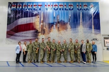 MAGNA, Utah - Chief Petty Officer Taylor Phillips, fourth from right, and Senior Chief Petty Officer Dwayne Chapman, second from right, pose with Sailors taking part in a hands-on training program at Strategic Systems Program’s (SSP) Program Management Office (PMO) Flight Systems (SPF), August 17-21. 
Strategic Systems Program’s (SSP) Program Management Offices (PMO) are the command’s eyes in the field as the government representatives for the design, development, production, installation, and testing of the Trident II D5 Strategic Weapon System (SWS) at industry facilities. For the Navy, the direct partnership by SSP’s Fleet liaison sailors at the PMOs is critical to connecting the warfighter operating the weapon system at the tip of the spear to the industry partners building the systems. 
As part of that partnership effort, SSBN Sailors were invited to detachments of Program Management Office Flight Systems (SPF) August 17-21 to take an exclusive behind-the-scenes look at the weapons system they maintain and operate at sea. Known as “Reverse Strategic Weapons Systems (SWS Week),” the recently established engagement is an opportunity for Sailors to meet and interact with the technical experts who build the weapon system.  
As SPF's Fleet Liaisons, Chapman and Phillips recently established SPF’s first-ever Reverse SWS Week. 
(U.S. Navy Photo by Shelby Thompson / Released)