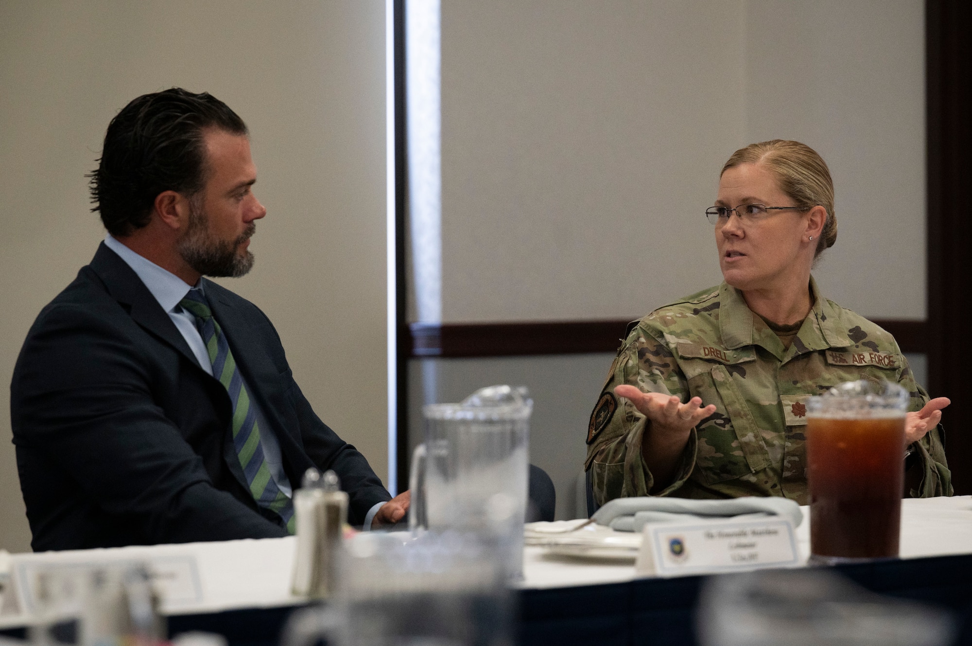 U.S. Air Force Maj. Kristin Drell, Air Mobility Command Surgeon General manpower and equipment force packaging system branch chief, speaks with Under Secretary of the Air Force Matt Lohmeier during a luncheon at Scott Air Force Base, Illinois, Sept. 15, 2025. Lohmeier’s visit allowed U.S. Transportation Command and Air Mobility Command senior leaders along with Airmen the opportunity to highlight how the commands are ready to project, maneuver, and sustain the joint force anytime, anywhere in support of national objectives. (U.S. Air Force photo by Staff Sgt. Dalton Williams)
