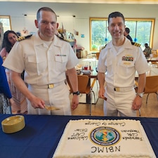 250910-O-NJ594-1178, Bethesda, Maryland, (August 22, 2025) -- Cmdr. Marshal Hoffman, outgoing officer in charge, right, and Captain Sklar, oncoming officer in charge, Navy Bloodborne Infection Management Center, left, poses for a photo during a change of charge ceremony at United Service Organization (USO) in Bethesda, Maryland, Aug. 22, 2025. The event honored Hoffman’s accomplishments and welcomed Sklar as the new officer in charge, reaffirming the center’s role in medical readiness, force health protection, and compassionate care for service members. (U.S. Navy photo by Ai Marrero)