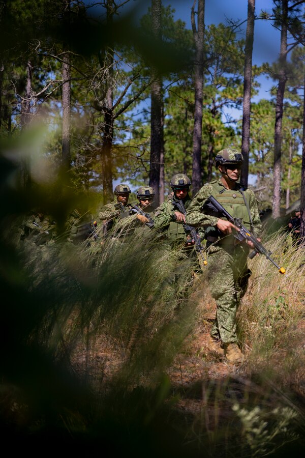 Marines with Infantería de Marina Colombiana (Colombian marine corps) conduct patrol lane training during exercise UNITAS 2025 at Marine Corps Base Camp Lejeune, North Carolina, Sept. 17, 2025. UNITAS, which is Latin for “unity,” was conceived in 1959 and has taken place annually since first conducted in 1960. This year marks the 66th iteration of the world’s longest running annual multinational maritime exercise. (U.S. Marine Corps photo by Lance Cpl. Payton Goodrich)