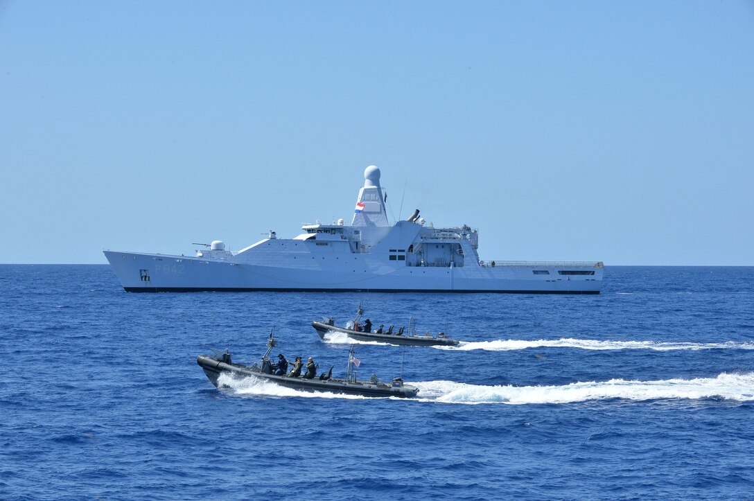 The Coast Guard Cutter Alert (WMEC 630) conducts contraband transfers with the Royal Netherlands Navy Holland-class offshore patrol vessel HNLMS Friesland (P842) and small boats, off the coast of Cuba, Aug. 4, 2025. These transfers culminated in the largest ship-to-ship drug transfer in Coast Guard history with Coast Guard Cutter Hamilton (WMSL 753) prior to their historic drug offload in Port Everglades. (U.S. Coast Guard photo by Ensign Nicholas Reeser)