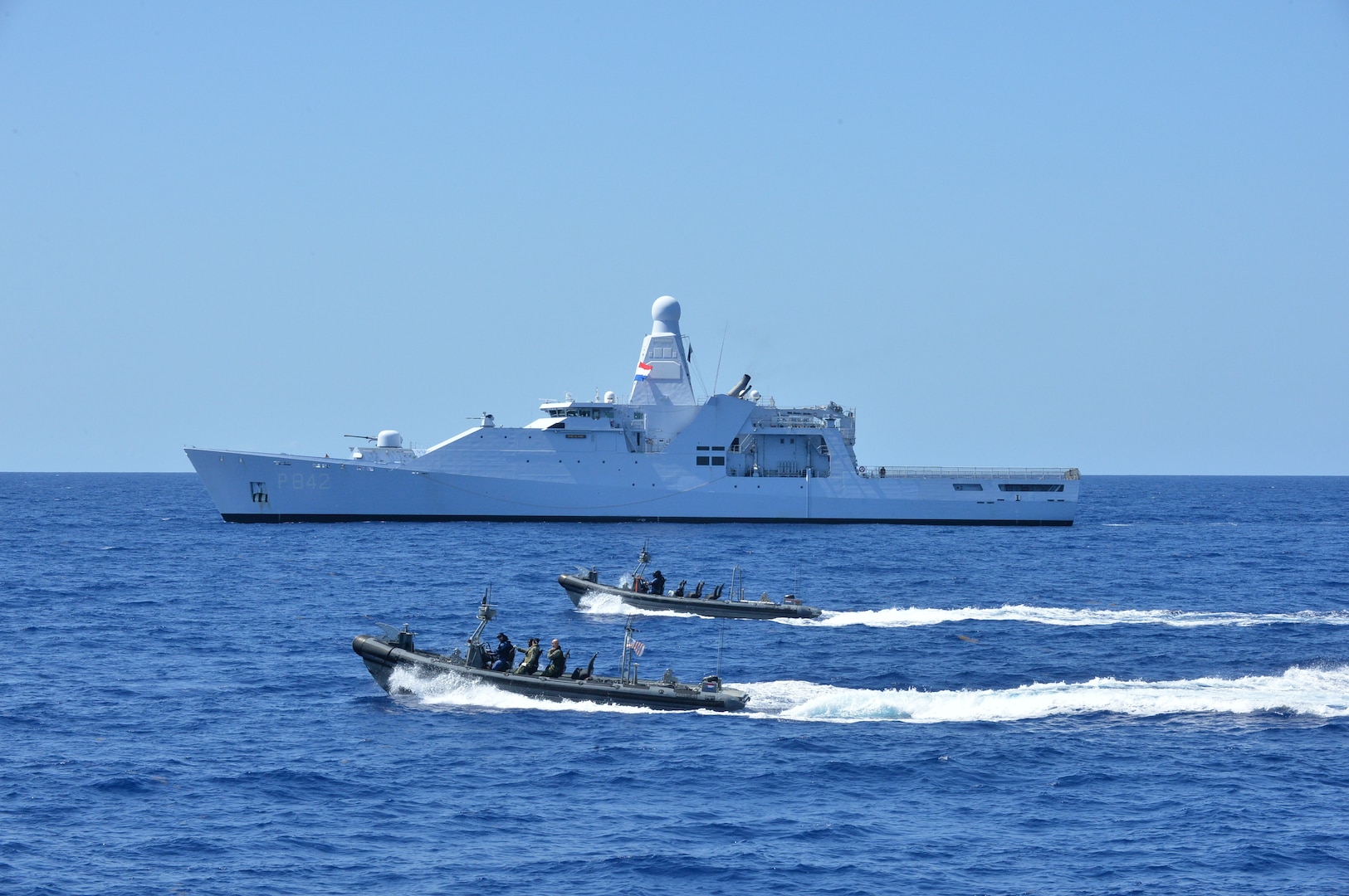 The Coast Guard Cutter Alert (WMEC 630) conducts contraband transfers with the Royal Netherlands Navy Holland-class offshore patrol vessel HNLMS Friesland (P842) and small boats, off the coast of Cuba, Aug. 4, 2025. These transfers culminated in the largest ship-to-ship drug transfer in Coast Guard history with Coast Guard Cutter Hamilton (WMSL 753) prior to their historic drug offload in Port Everglades. (U.S. Coast Guard photo by Ensign Nicholas Reeser)