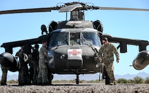 U.S Army Staff Sgt. Cody Solomon, a flight paramedic assigned to Charlie Company, 2nd General Support Aviation Battalion, 1st Aviation Regiment, 1st Combat Aviation Brigade, 1st Infantry Division, instructs Explosive Ordnance Disposal Airmen assigned to the 56th Fighter Wing on hoist training