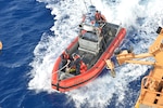 Small boat crew members from the Coast Guard Cutter Alert (WMEC 630) return from illicit contraband transfers off the coast of Haiti, Aug. 11, 2025. Alert’s crew conducted the largest at-sea contraband transfer with Coast Guard Cutter Hamilton (WMSL 753). (U.S. Coast Guard photo by Ensign Nicholas Reeser)